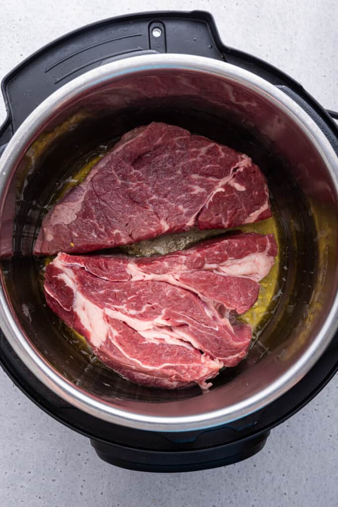 Overhead view of uncooked chuck roast in Instant Pot