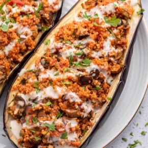 Eggplant stuffed with quinoa and vegetables on plate