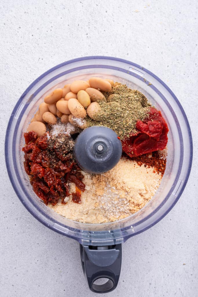 Overhead view of ingredients for vegan meatballs in food processor bowl