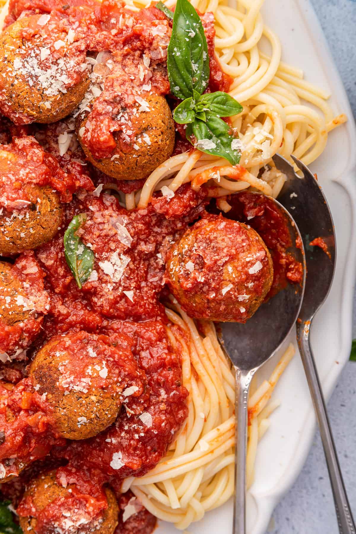 Overhead view of vegan meatballs on platter of spaghetti