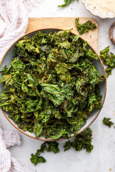 Overhead view of crispy air fryer kale chips in bowl