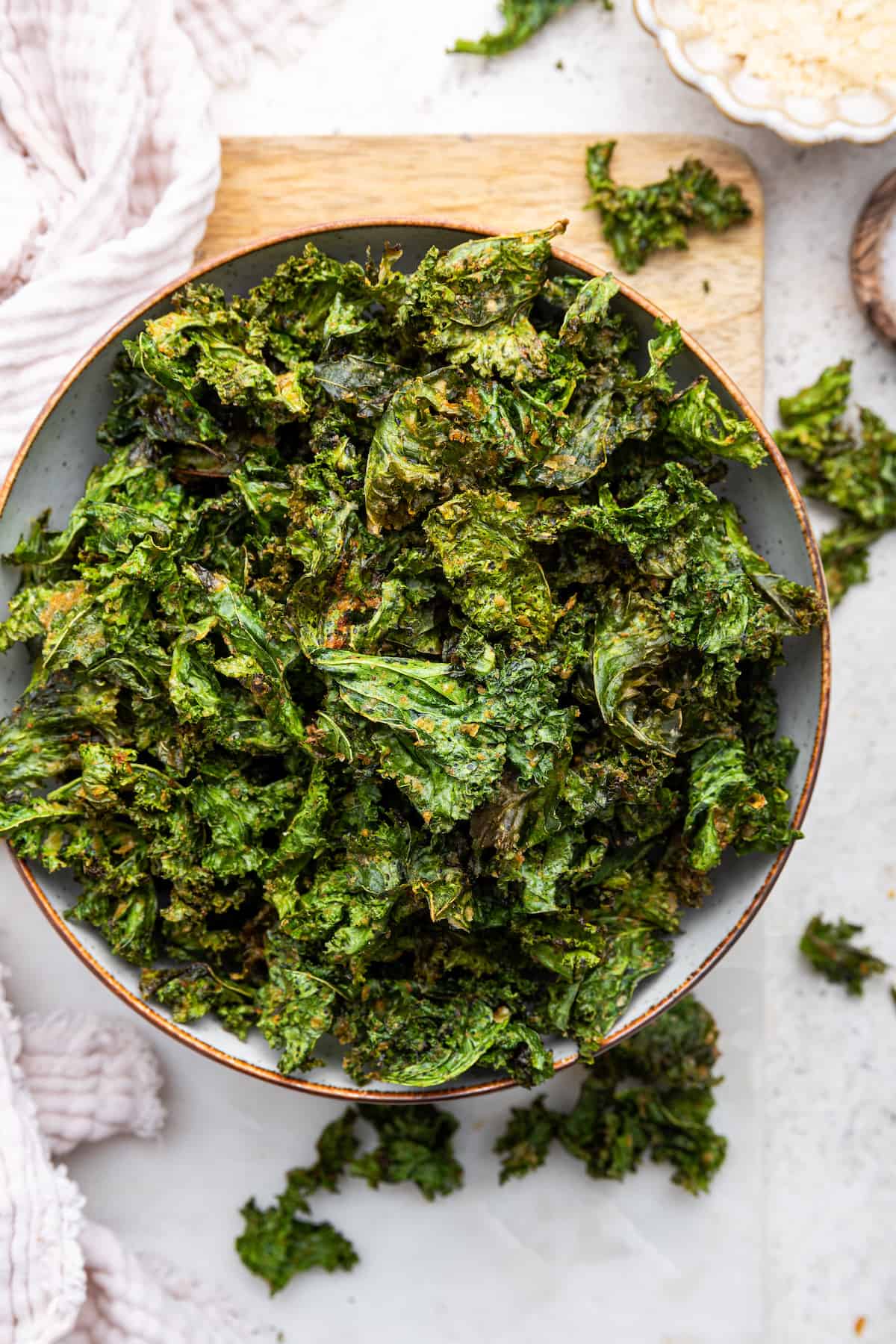 Overhead view of crispy air fryer kale chips in bowl