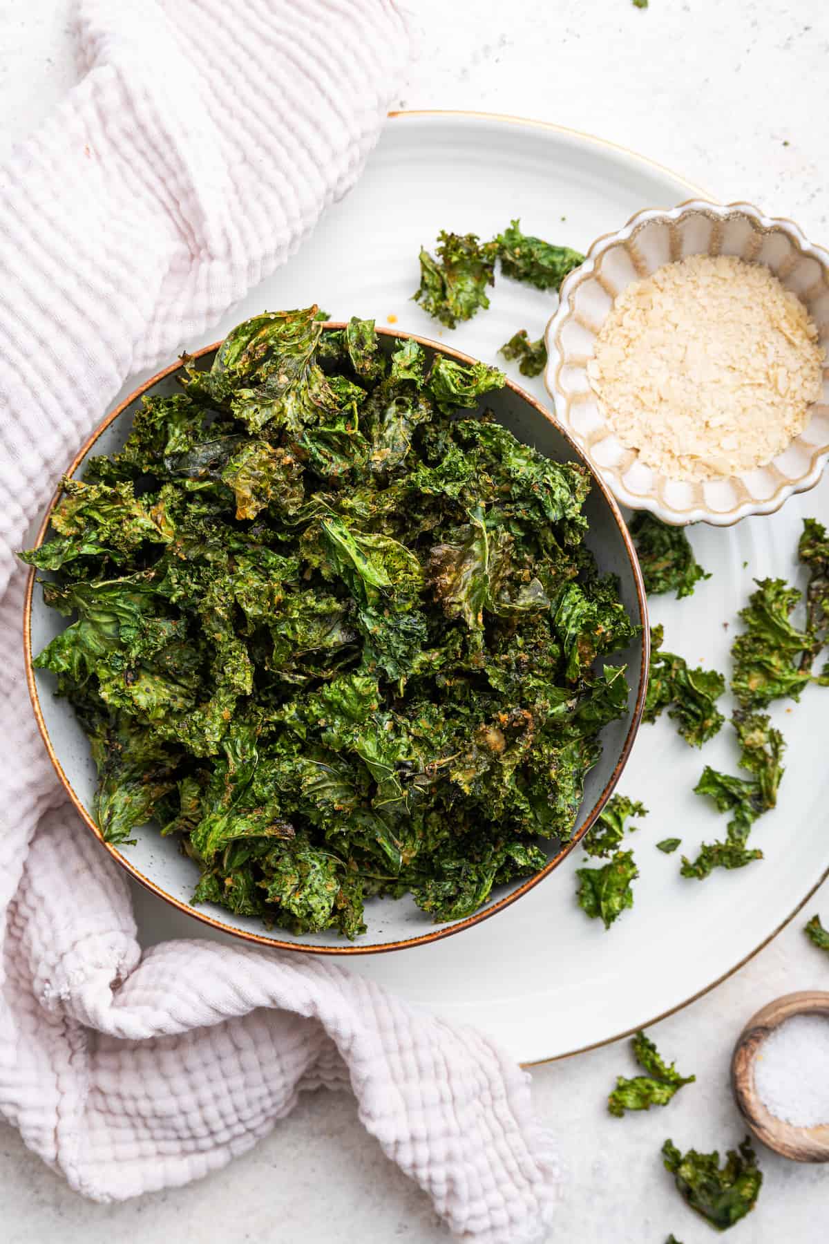 Overhead view of air fryer kale chips in bowl
