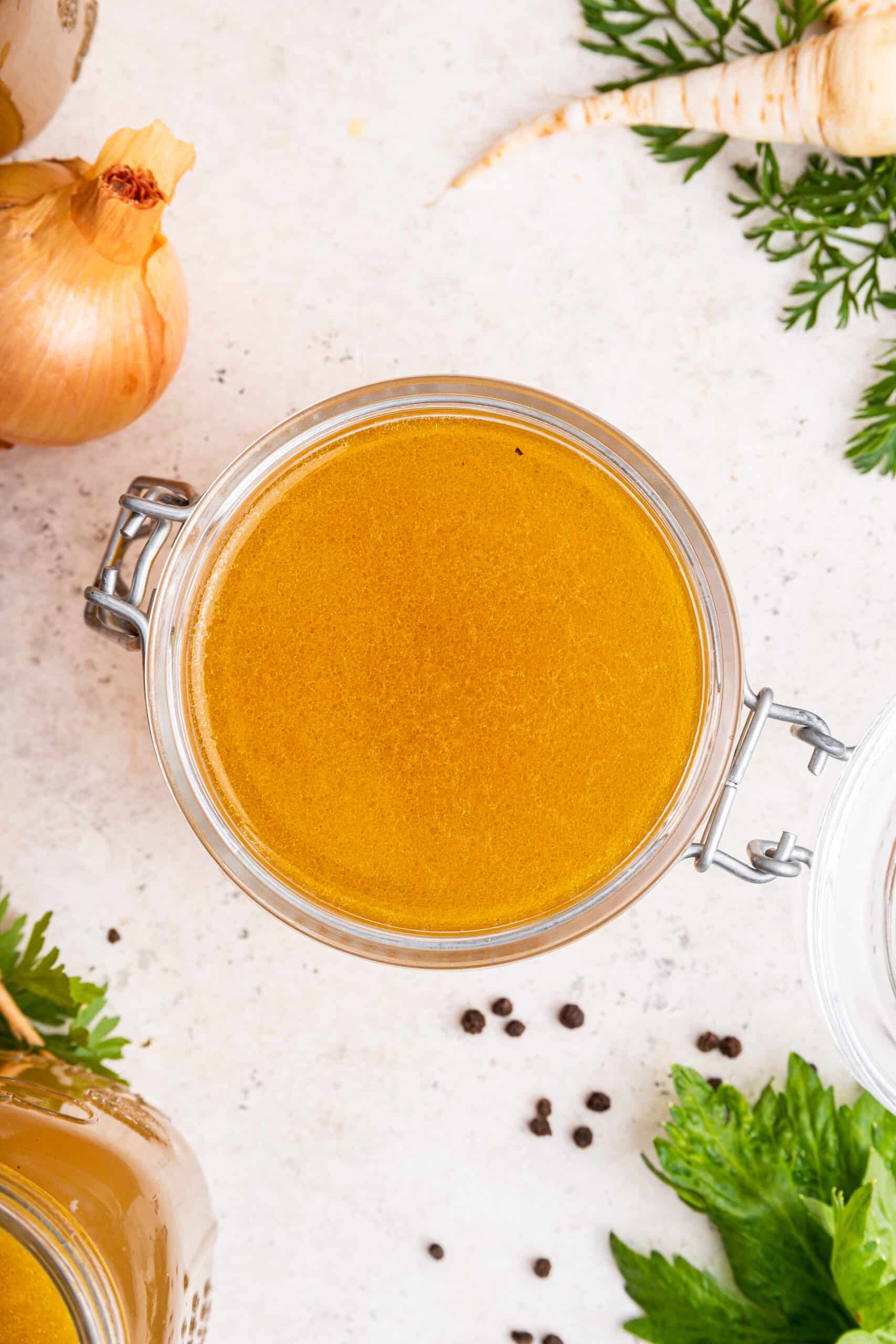 Overhead view of Instant Pot chicken bone broth in jar