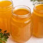 3 jars of Instant Pot chicken bone broth on countertop