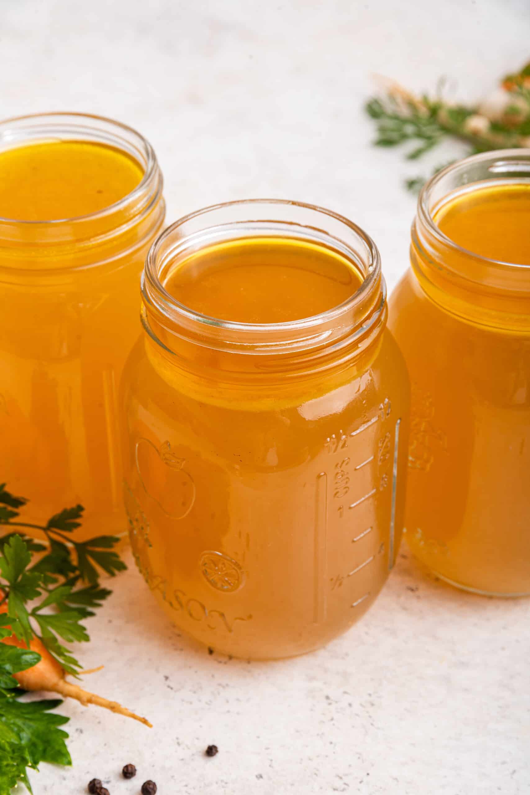 3 jars of Instant Pot chicken bone broth on countertop