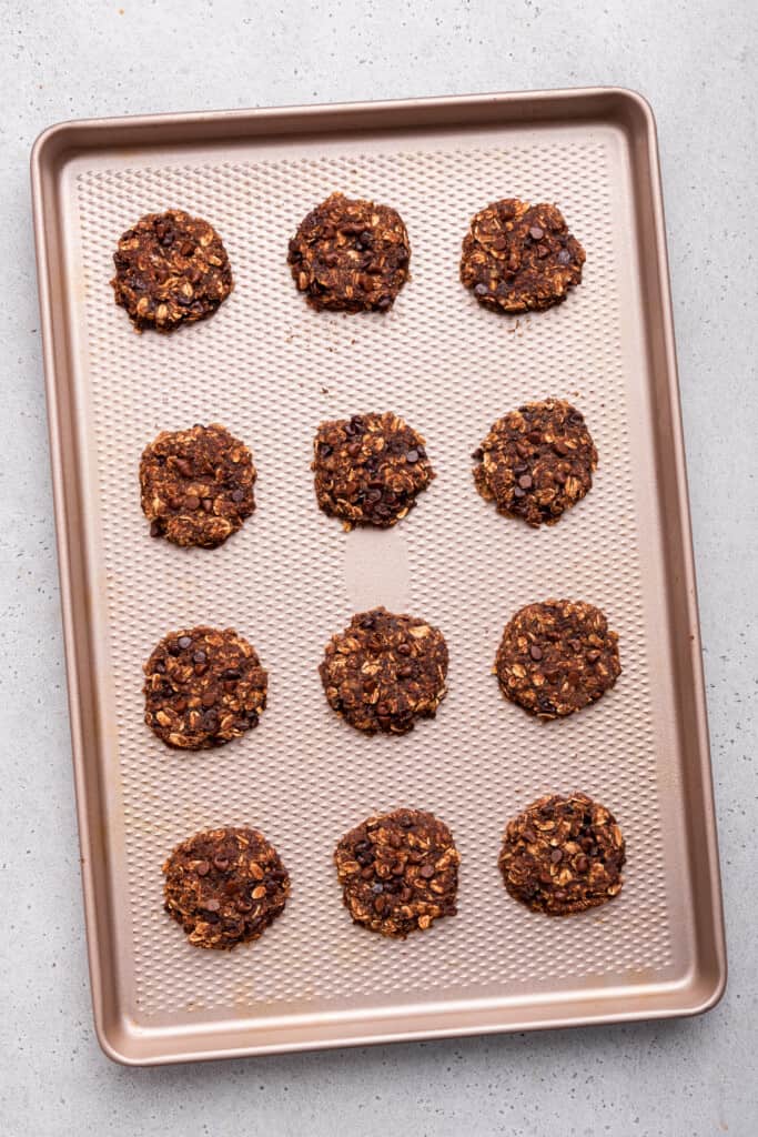 Overhead view of banana oatmeal cookies on baking sheet