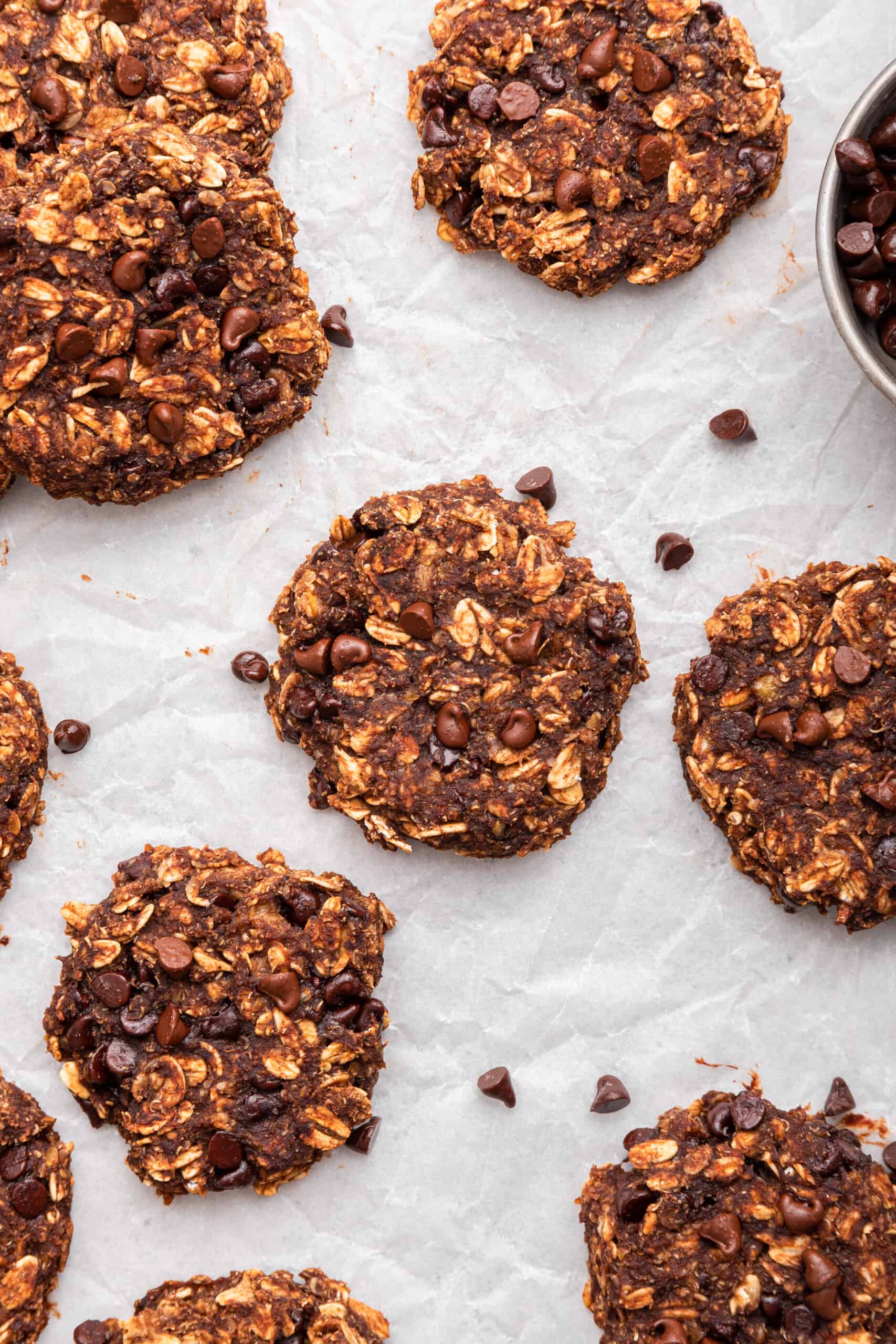 Overhead view of banana oatmeal cookies on crumpled parchment paper