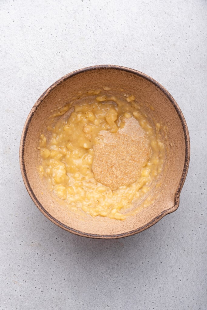 Overhead view of banana and flax egg in bowl