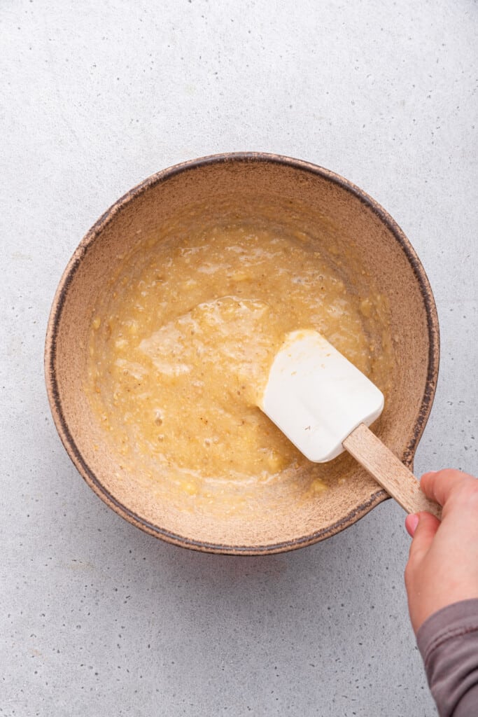 Overhead view of wet ingredients for banana oatmeal cookies in bowl