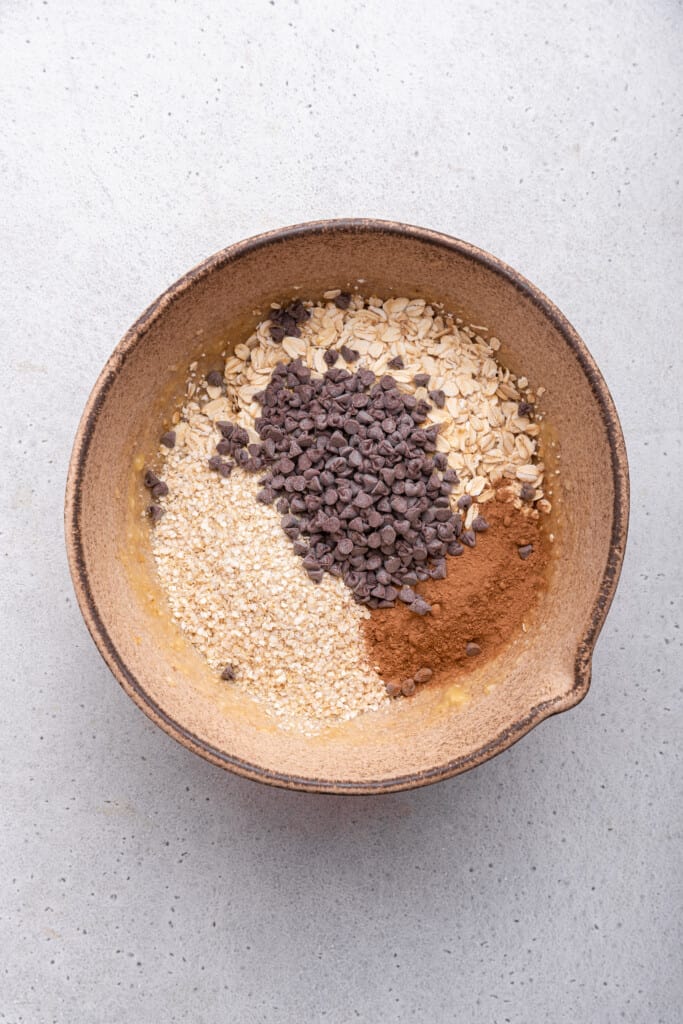 Overhead view of dry ingredients for banana oatmeal cookies in bowl