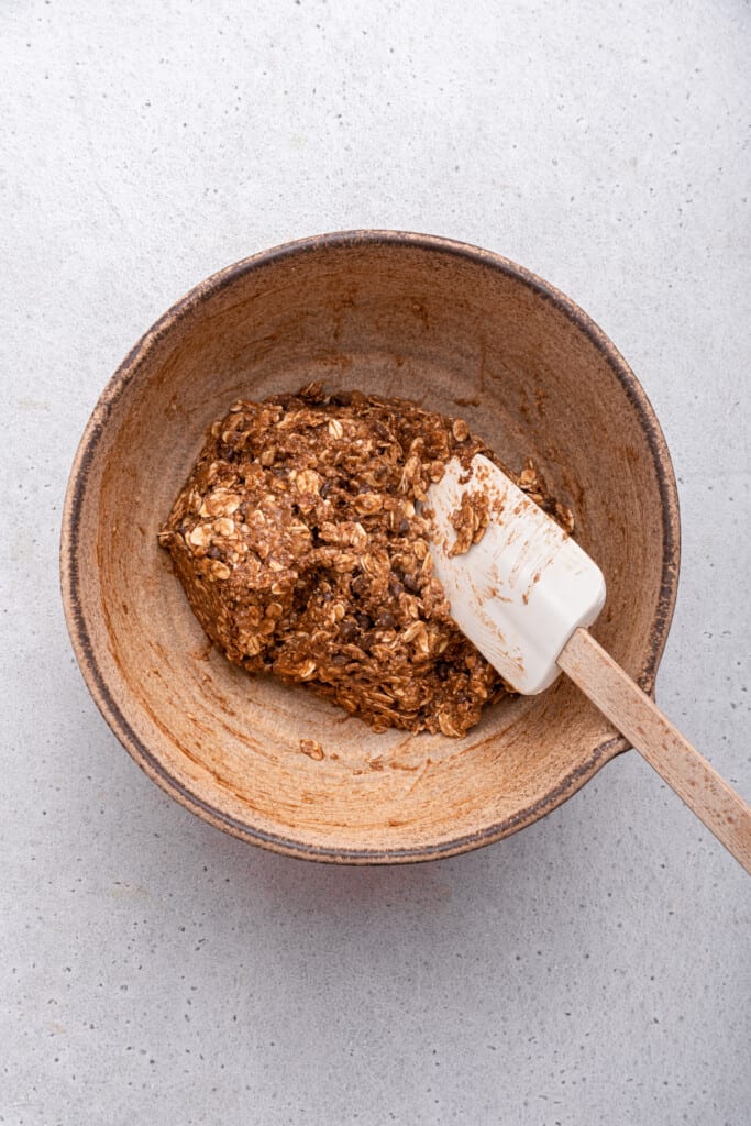 Bowl of banana oatmeal cookies with spatula