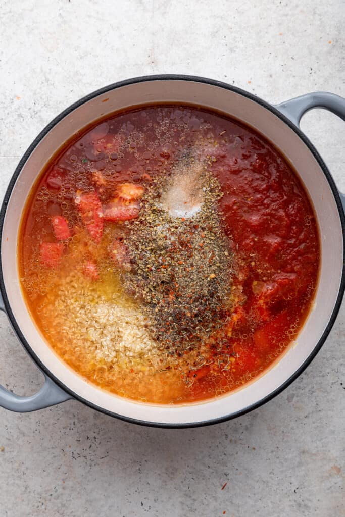 Spices and seasonings added to roasted red pepper soup