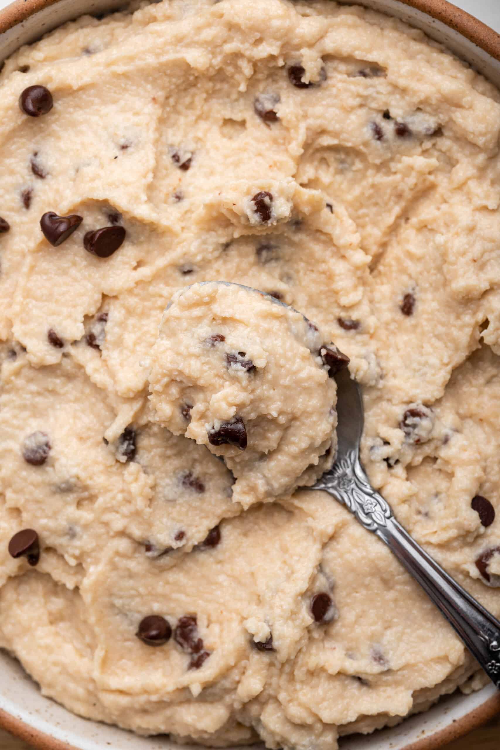 Bowl of chocolate chip cottage cheese cookie dough with spoon