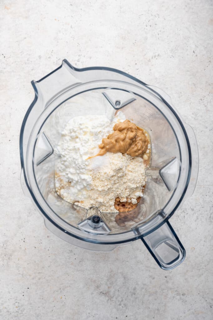 Overhead view of ingredients for cottage cheese cookie dough in blender