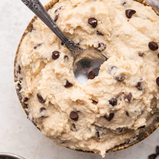 Overhead view of cottage cheese cookie dough in bowl with spoon