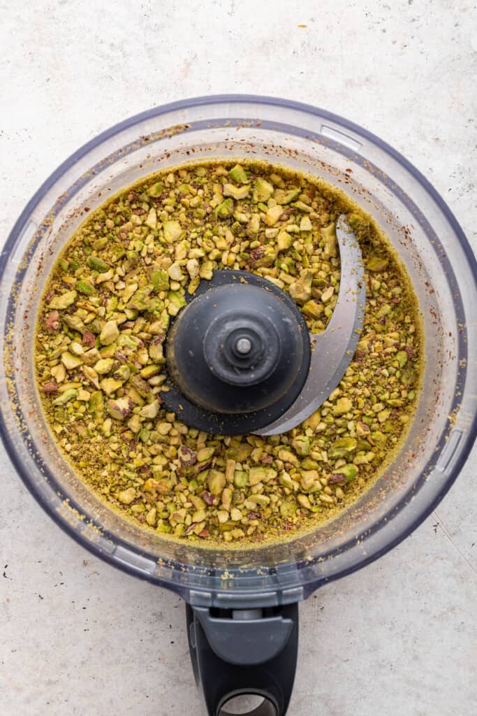 Overhead view of pistachios in food processor