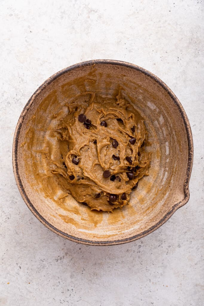 Overhead view of tahini cookie dough in mixing bowl