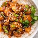 Overhead view of sticky honey sriracha chicken with rice in bowl