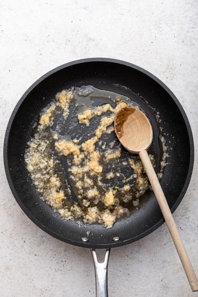 Cooking ginger and garlic in skillet