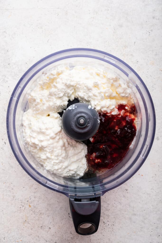 Ingredients for sweet whipped ricotta cheese in food processor