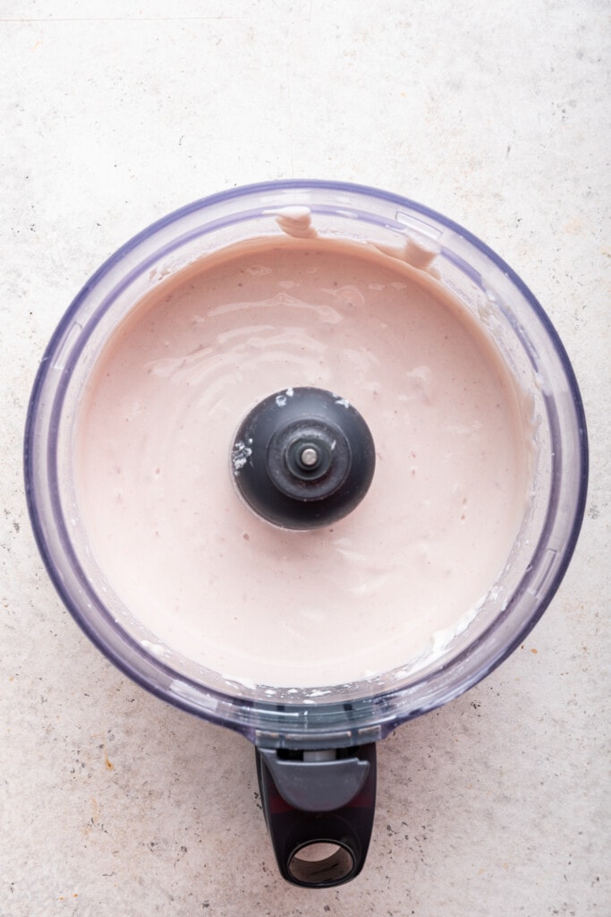 Overhead view of whipped cottage cheese in food processor