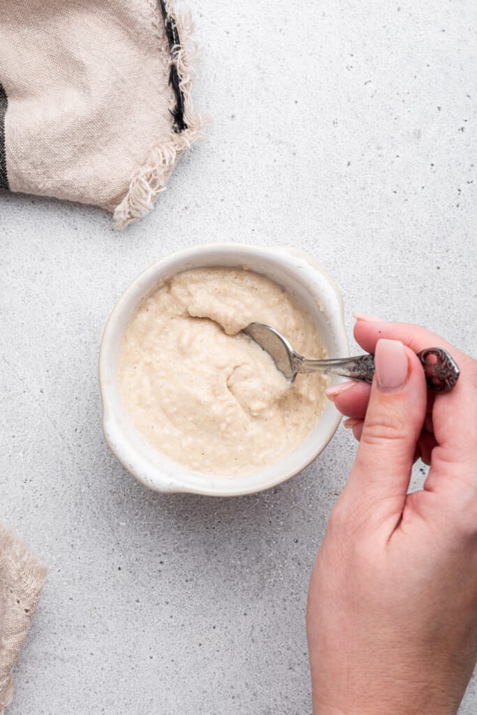 Stirring baby oatmeal in bowl