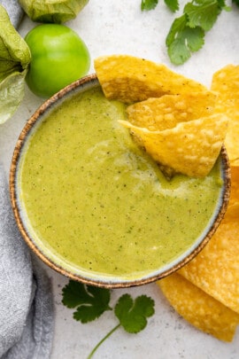 Tomatillo salsa in bowl with tortilla chips