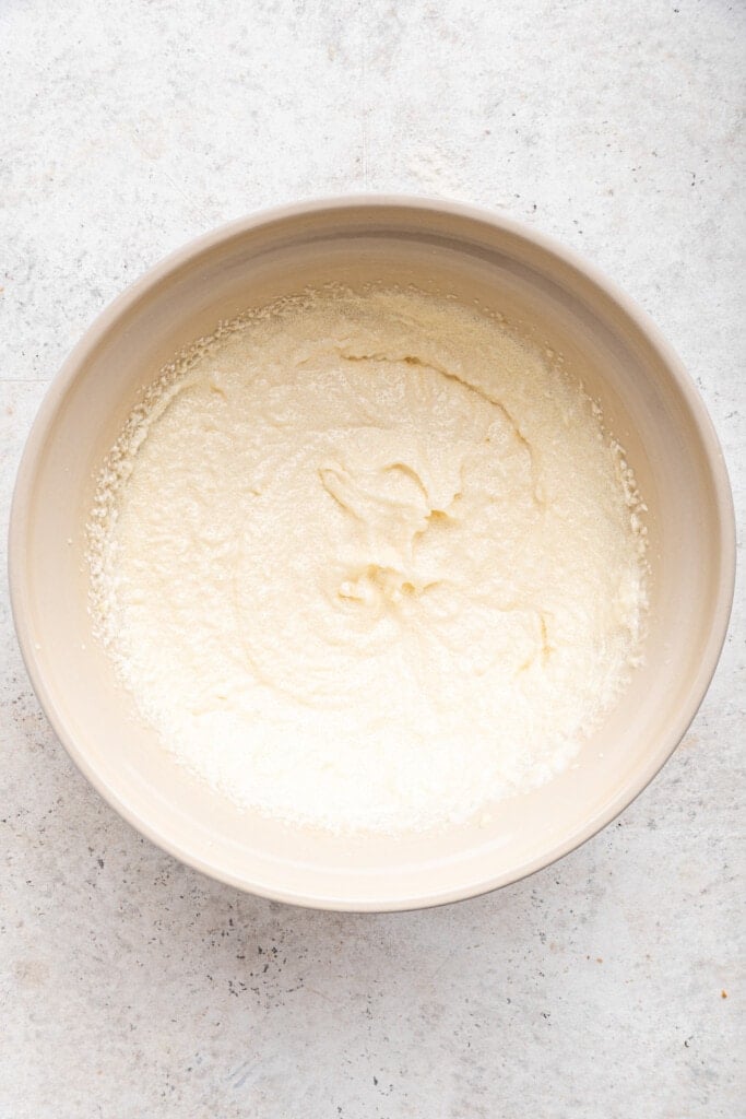 Overhead view of wet ingredients for cake in mixing bowl