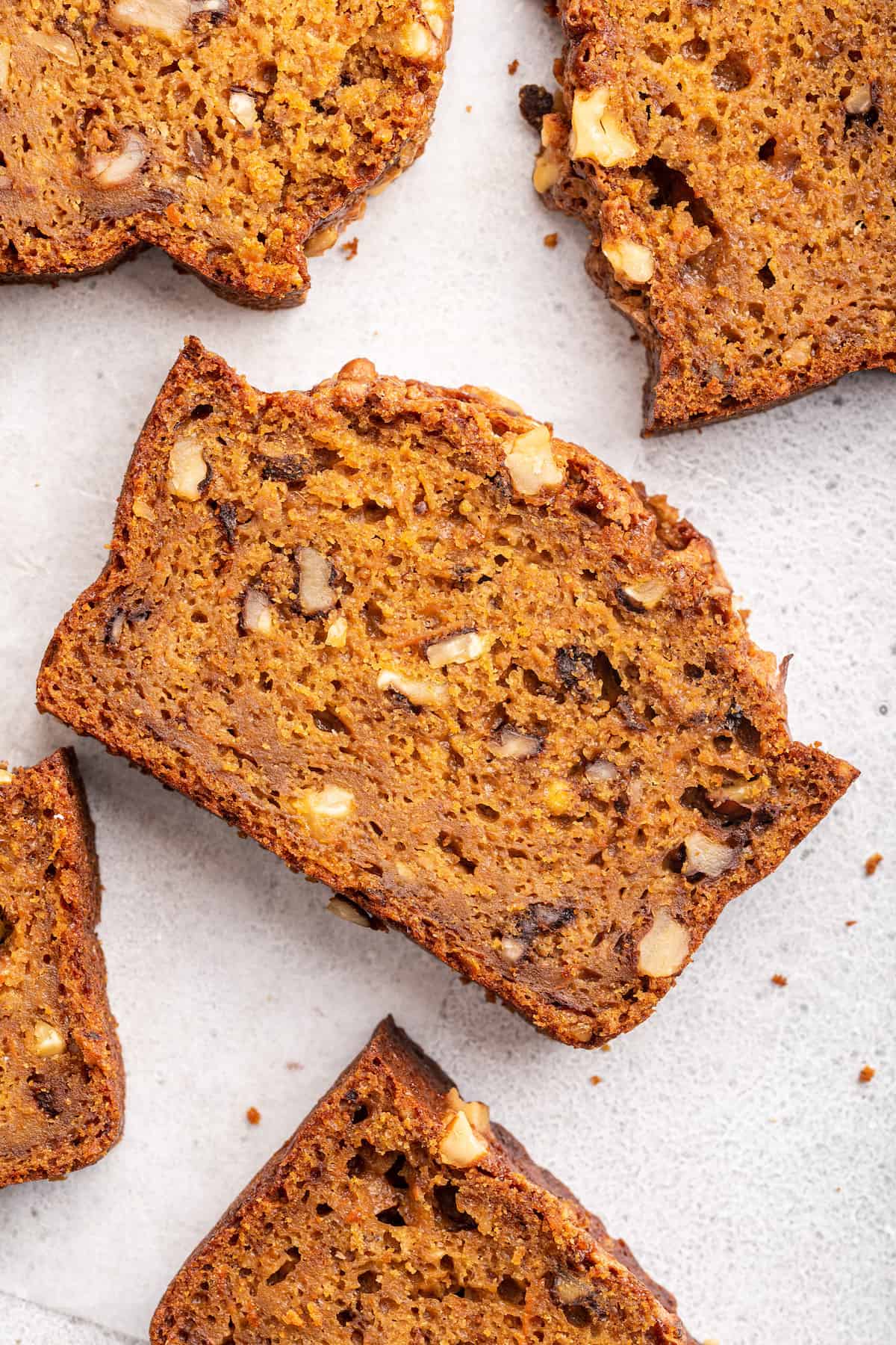 Overhead view of carrot bread slices on counter