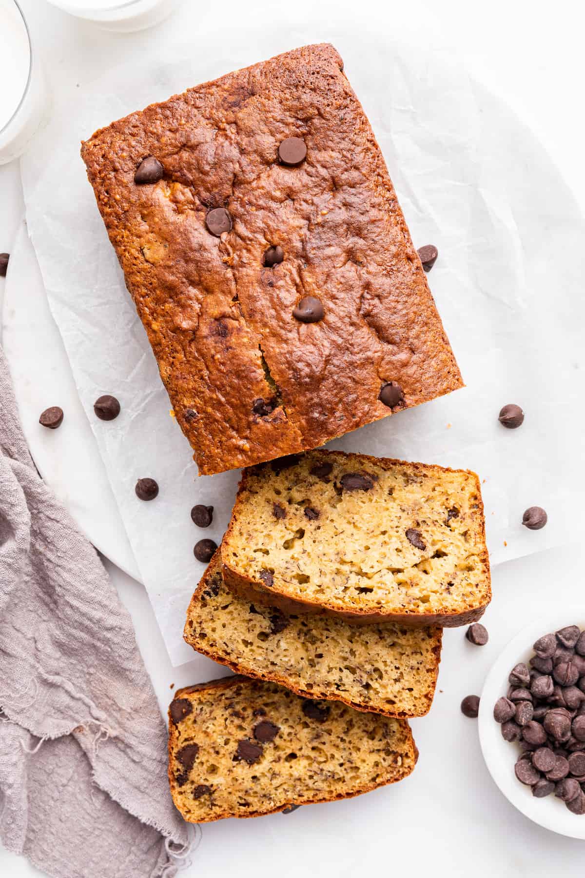 Overhead view of protein banana bread loaf with 3 cut slices