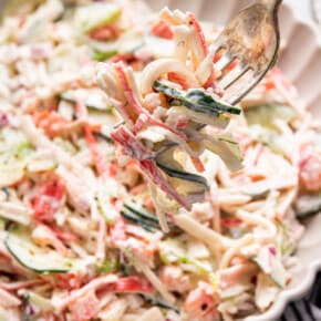 Forkful of creamy surimi salad
