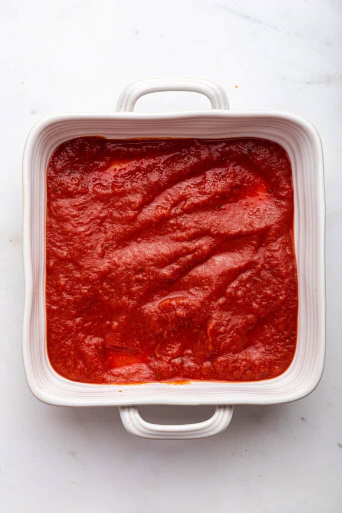Marinara in bottom of baking dish