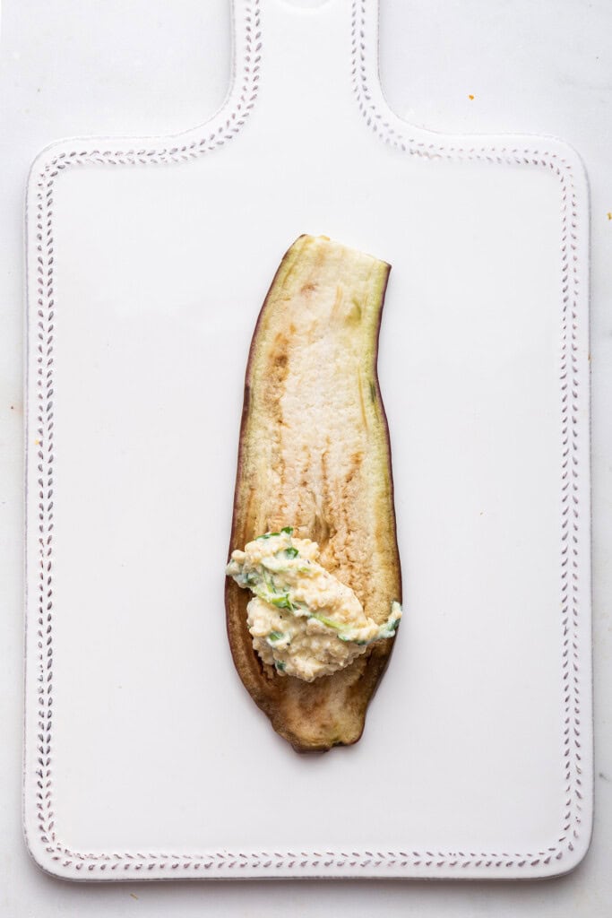 Cheesy filling added to eggplant slice