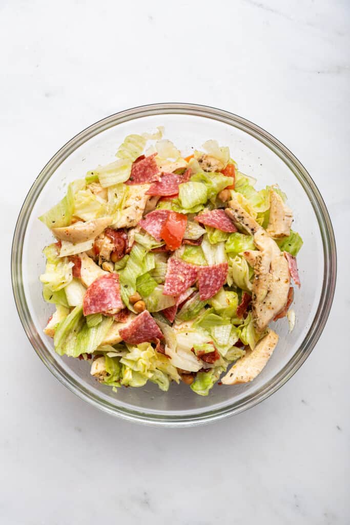 Overhead view of Jennifer Aniston salad in mixing bowl