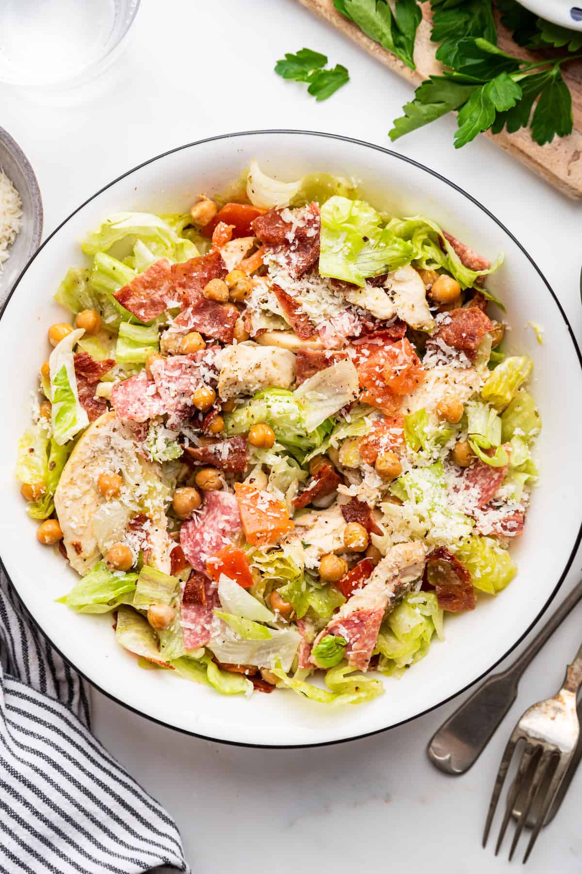 Inspired by a Cobb salad but WAY better, the Jennifer Aniston salad is filling, fresh, and flavorful, making it perfect for weekday lunches! Overhead view of Jennifer Aniston salad in bowl