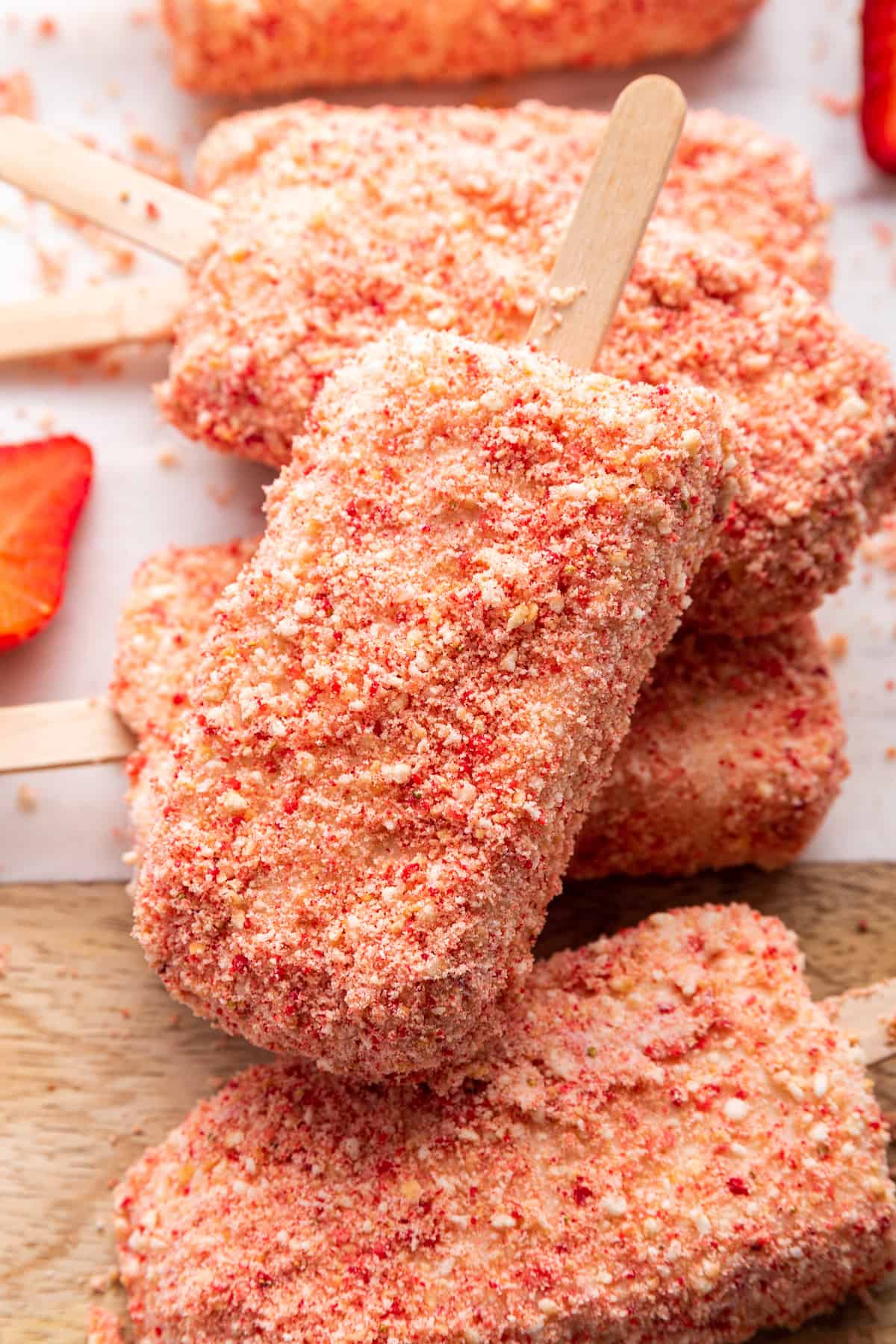 Strawberry shortcake ice cream bars on wood board