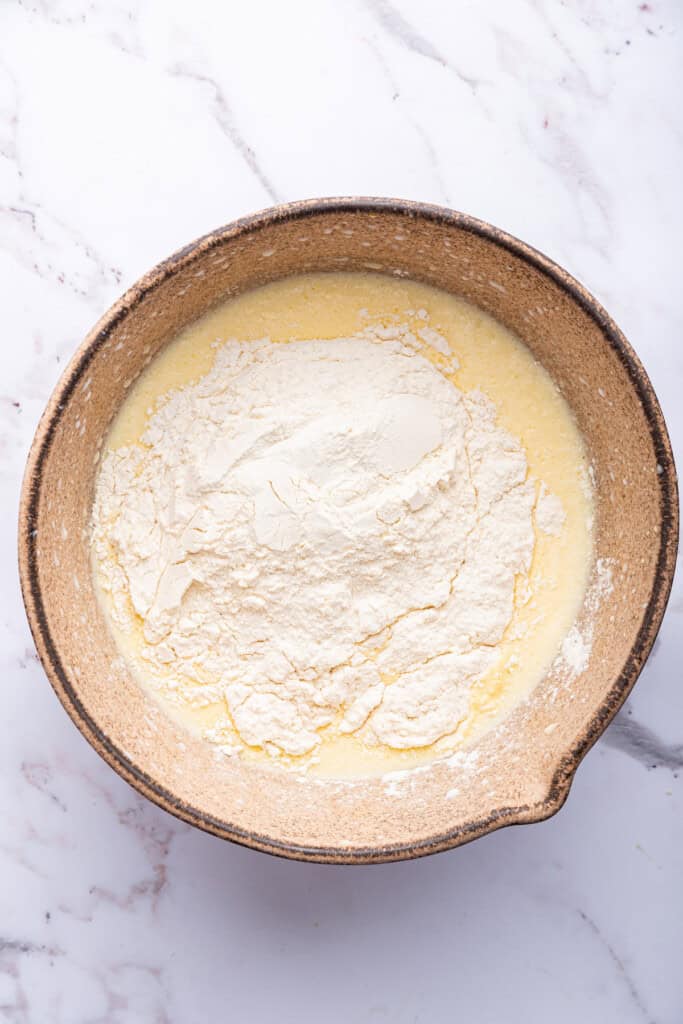 Dry ingredients for waffles added to mixing bowl