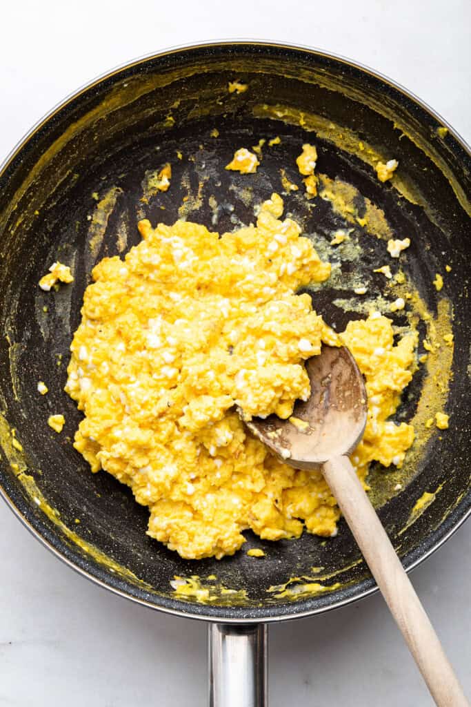 Overhead view of cottage cheese eggs in skillet