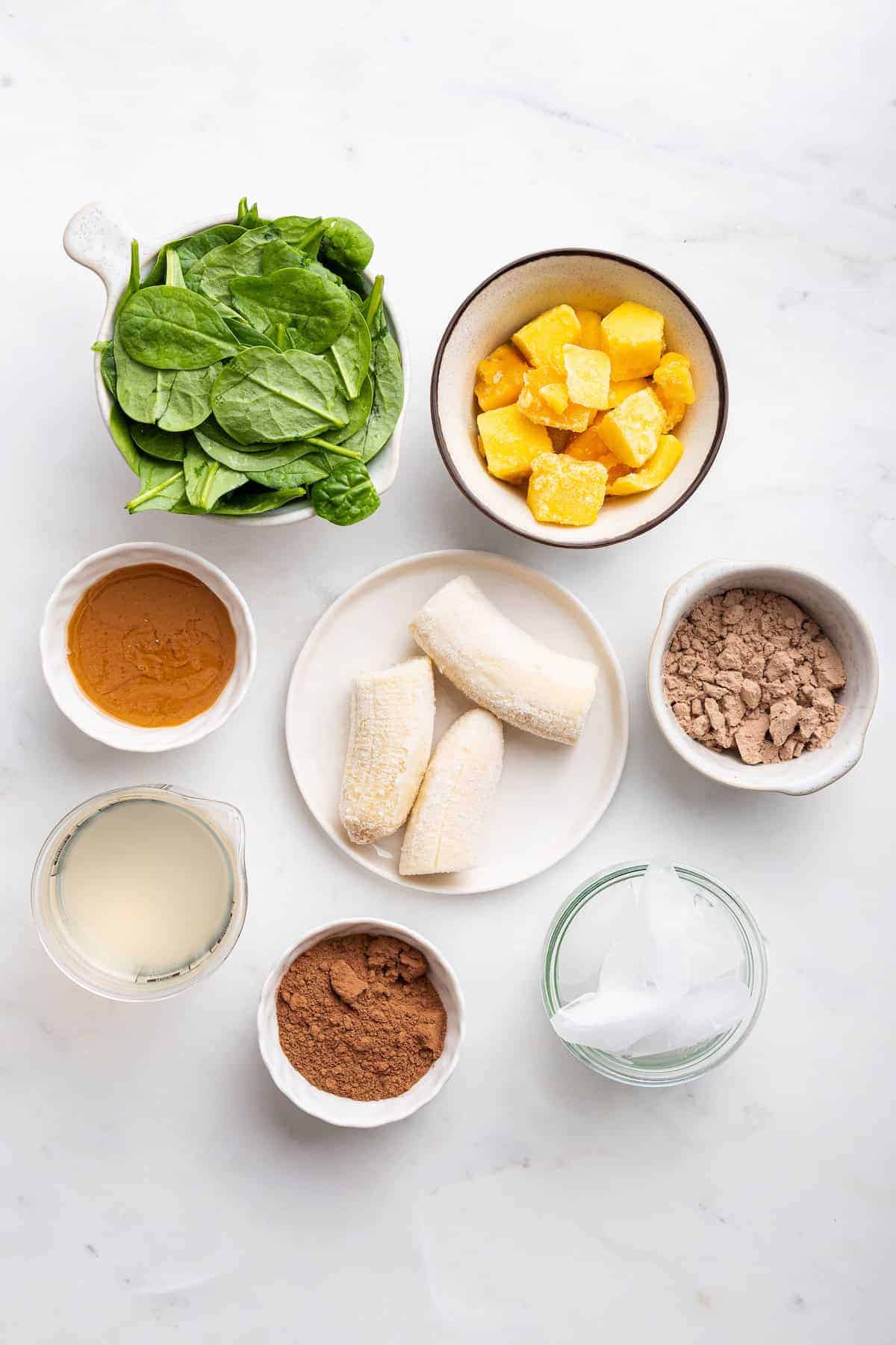 Overhead view of chocolate peanut butter smoothie ingredients