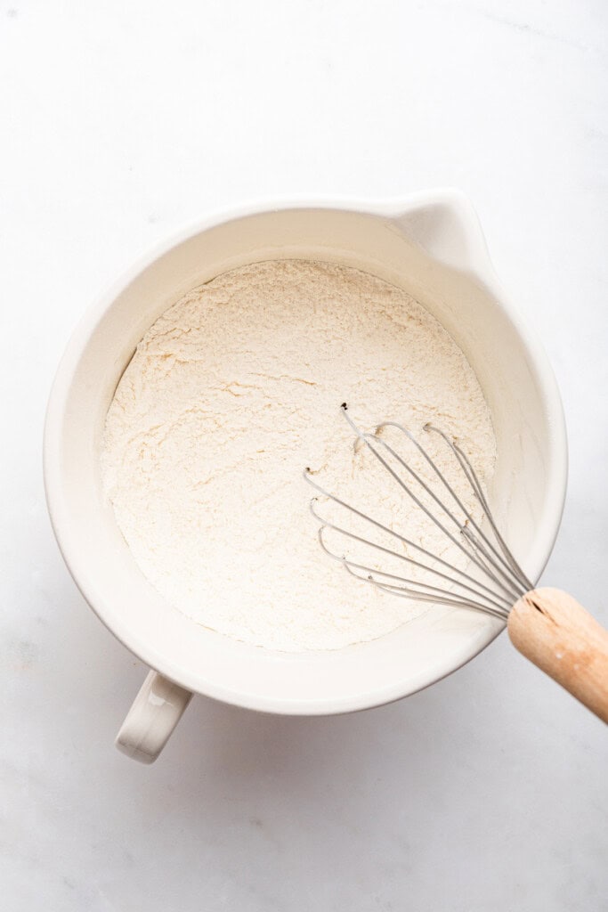 Overhead view of dry ingredients for strawberry cobbler in bowl