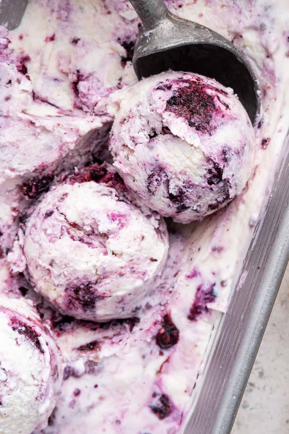Cottage cheese ice cream is rich, creamy and perfect for adding all your favorite mix-ins—but the best part is that it’s packed with protein! Scoops of berry cottage cheese ice cream in pan