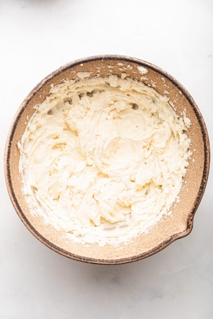 Frosting for fruit pizza in mixing bowl