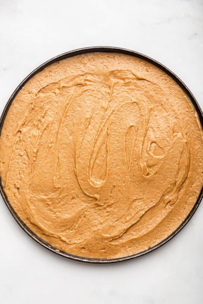 Overhead view of batter for fruit pizza in pan