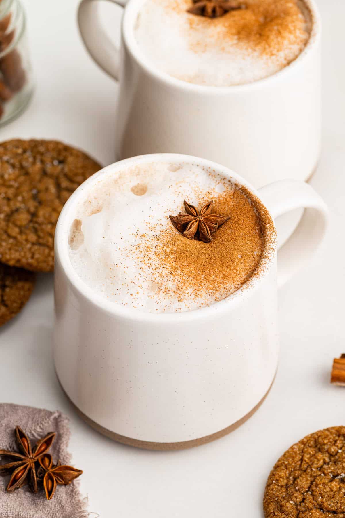 With sweet honey, cozy spices, and warm milk, this chai latte recipe is a winter favorite that's so easy to make at home! Two mugs of chai latte