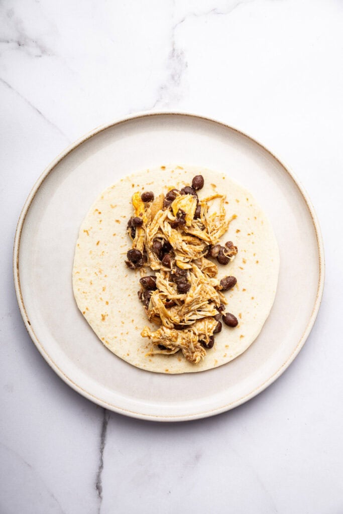 Black beans and chicken on tortilla