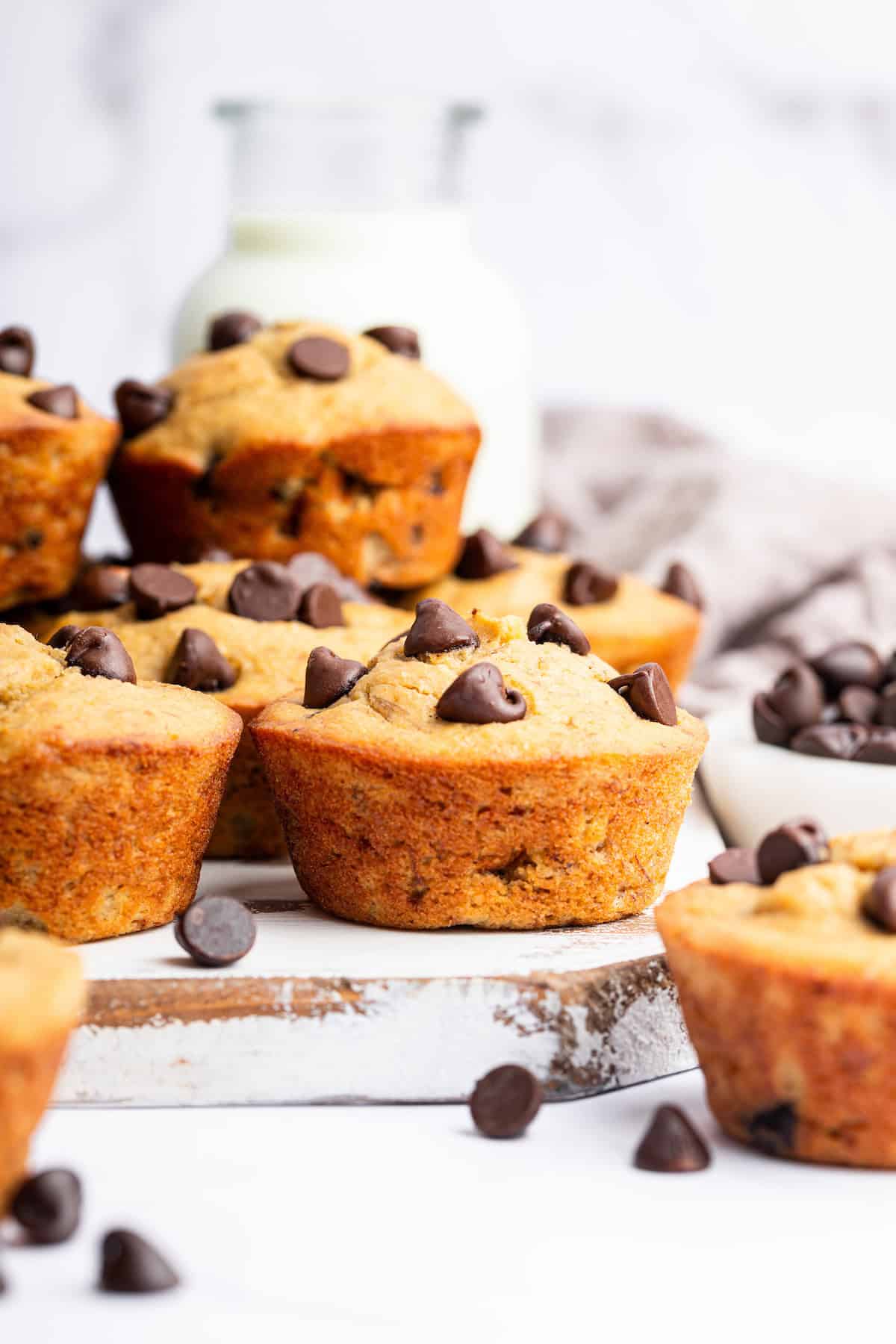 Side view of banana protein muffins on cutting board
