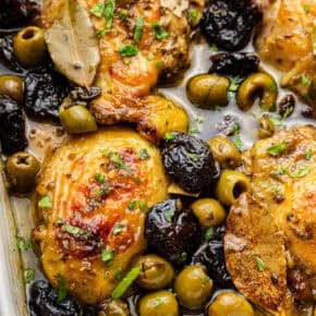Overhead view of chicken marbella in baking dish