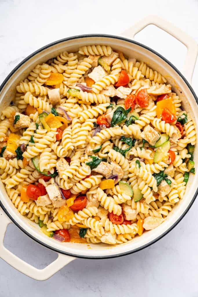 Overhead view of chicken pasta primavera in pot