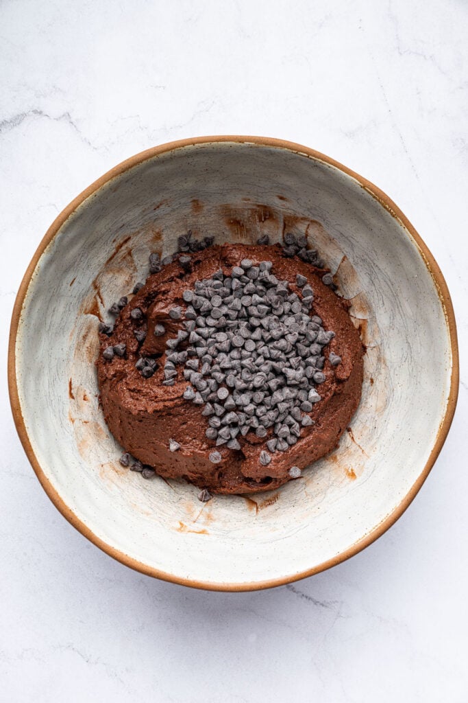 Chocolate chips in bowl of edible brownie batter